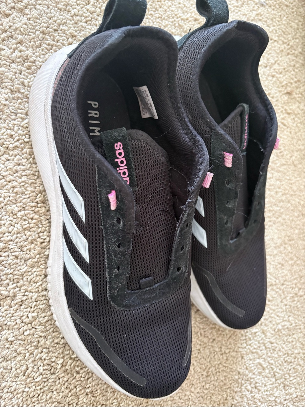 adidas Womenโs Black Athletic Sneakers with Pink Highlights
